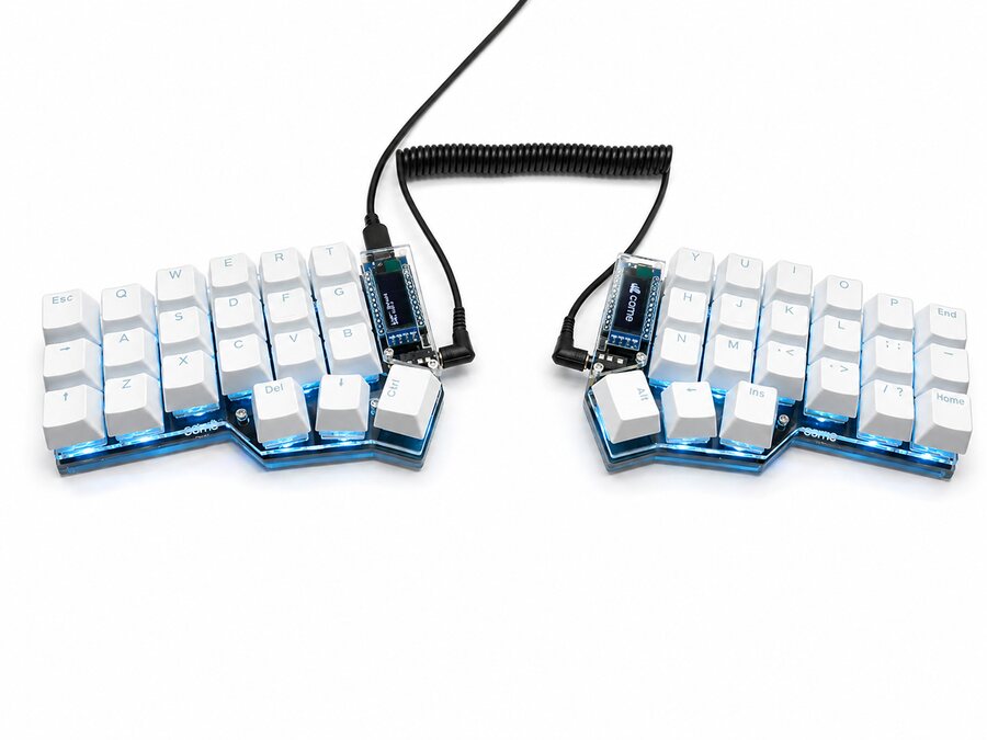 Assembled Corne with white keycaps, photographed on a white background